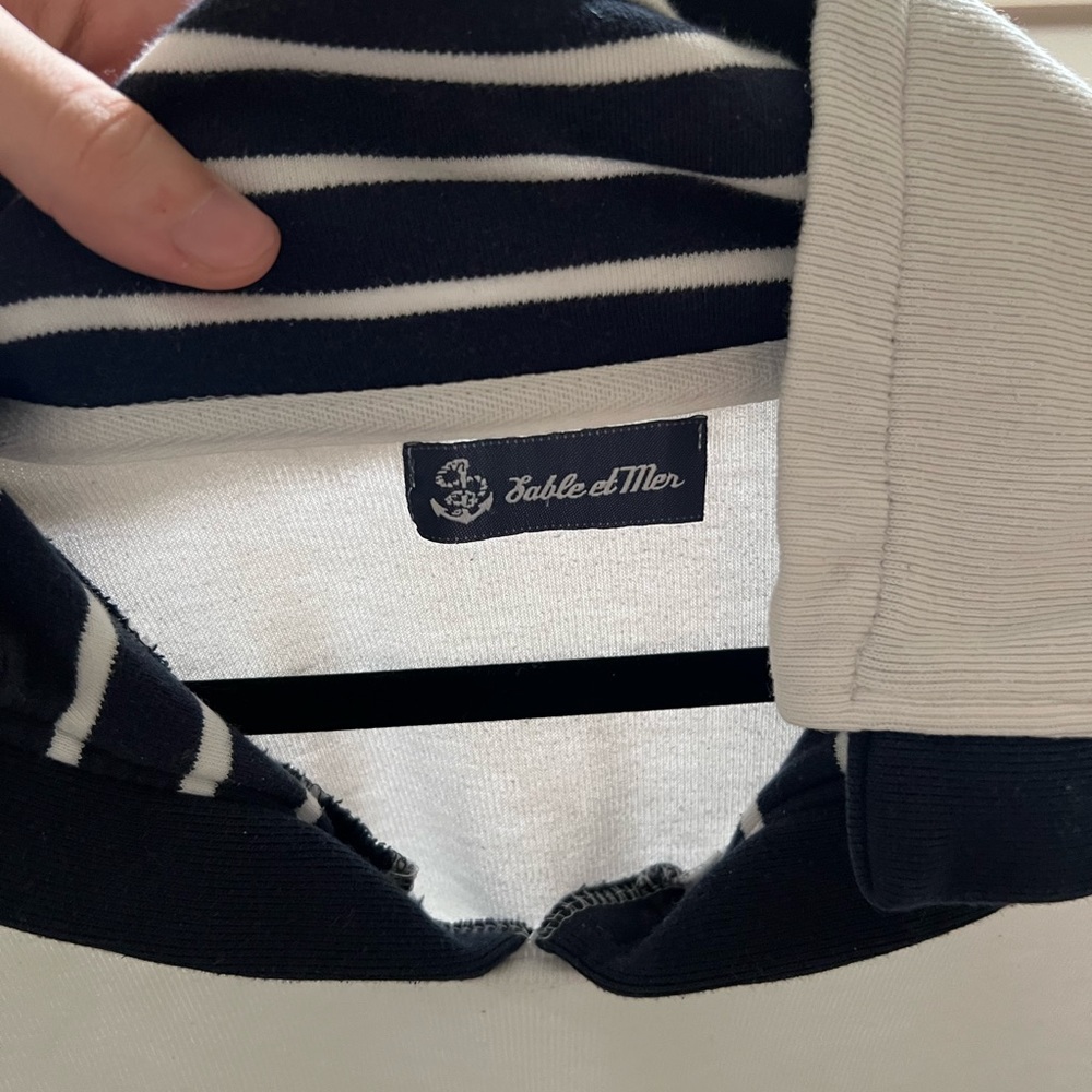 cute sailing sweater. comfy and warm! White with dark blue on collar.